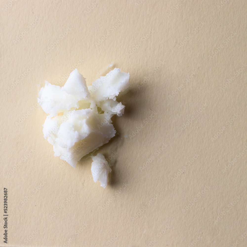 White creamy texture of cleansing butter on beige background.Cosmetic swatch - obrazy, fototapety, plakaty 