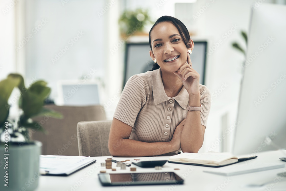 Relaxed young female financial advisor working as an accounting employee or admin portrait. Female work staff counting money and calculating a budget for a department in a company