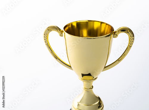 Fotografie Golden trophy on white background