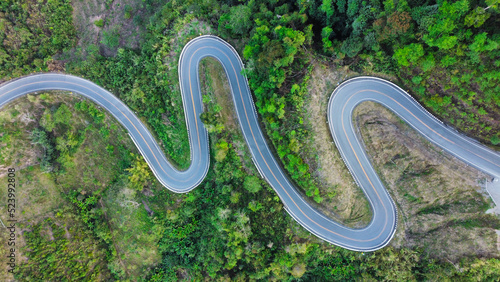 Aerial view road in mountain at thailand. Texture of forest and road view from above.