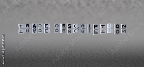 trade description word or concept represented by black and white letter cubes on a grey horizon background stretching to infinity