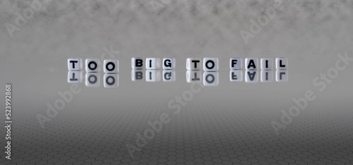 too big to fail word or concept represented by black and white letter cubes on a grey horizon background stretching to infinity