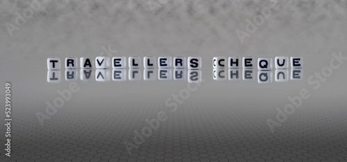 travellers cheque word or concept represented by black and white letter cubes on a grey horizon background stretching to infinity