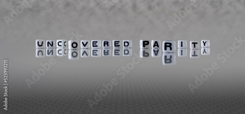 uncovered parity word or concept represented by black and white letter cubes on a grey horizon background stretching to infinity