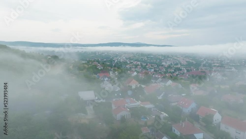 Ascent towards the fog, Pécs, Hungary, morning, mountain in background, village , summer, dawn , air 