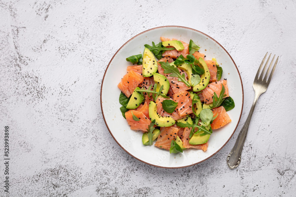 Salmon salad with avocado, for keto and low carb diet. Rusty background, top view, copy space. Salmon salad with avocado, for keto and low carb diet. Rusty background, top view, copy space.