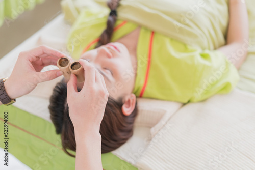 Young Asian women in moxibustion health museum