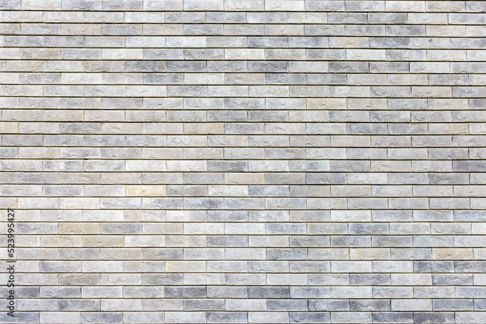 Natural stone color brick wall textured background Natural stone color brick wall textured background
