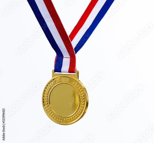 Blank gold medal on white background photo
