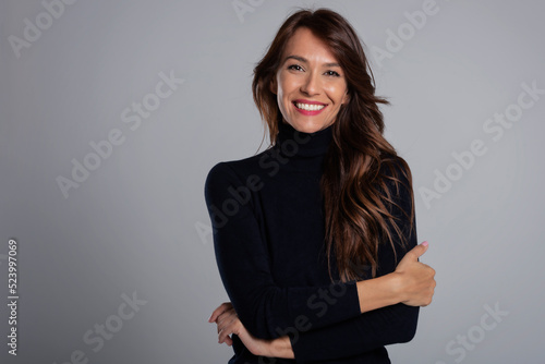 Wallpaper Mural Confident and beautiful long haired woman studio portrait Torontodigital.ca