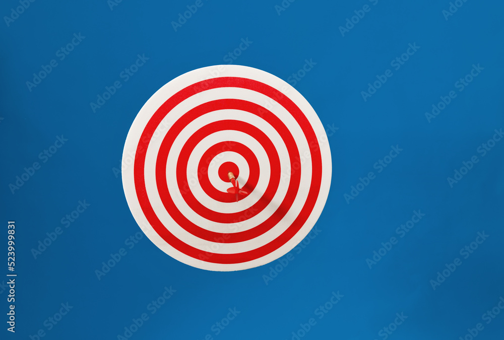 Dart hitting on center target Dart hitting on center target