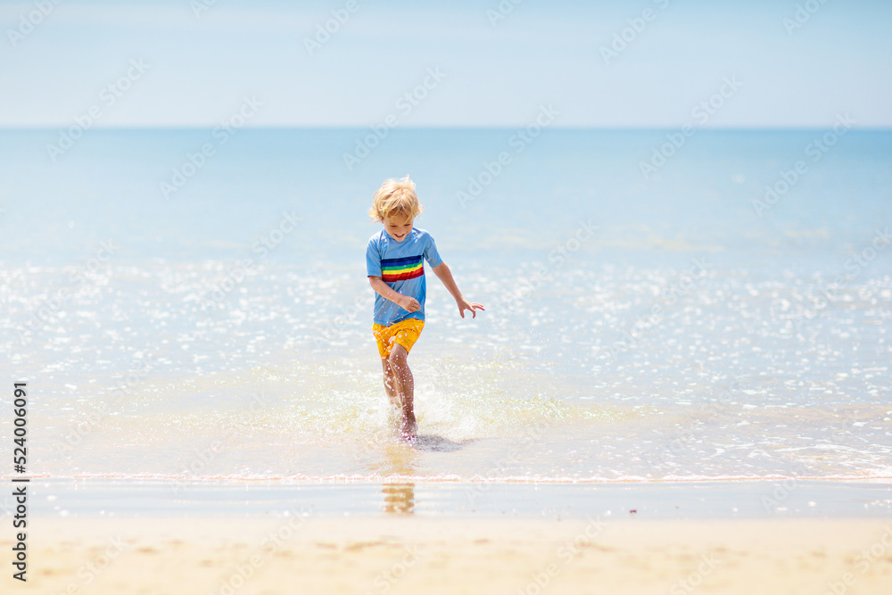 Kids playing on beach. Children play at sea. Kids playing on beach. Children play at sea.