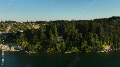 Aerial view pushing towards a long house on the Cpupeville shoreline. photo