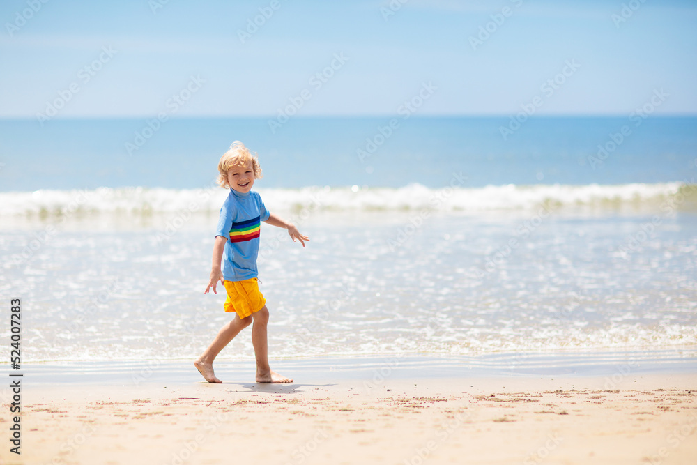 Kids playing on beach. Children play at sea. Kids playing on beach. Children play at sea.