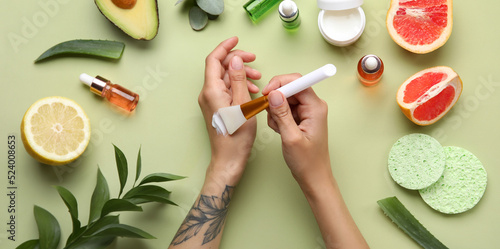 Woman applying natural crea...