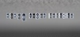 honor among thieves word or concept represented by black and white letter cubes on a grey horizon background stretching to infinity