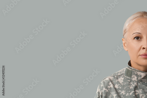 Mature female soldier on gr...