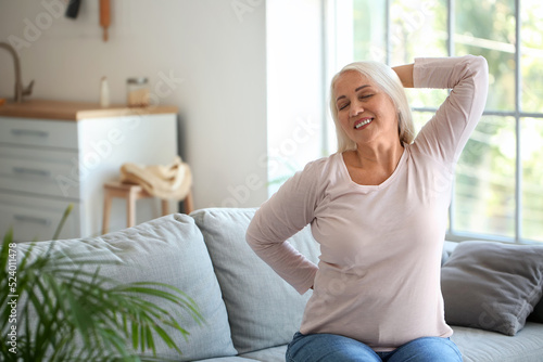 Mature woman with back pain...