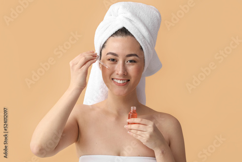 Young Asian woman with cosm...