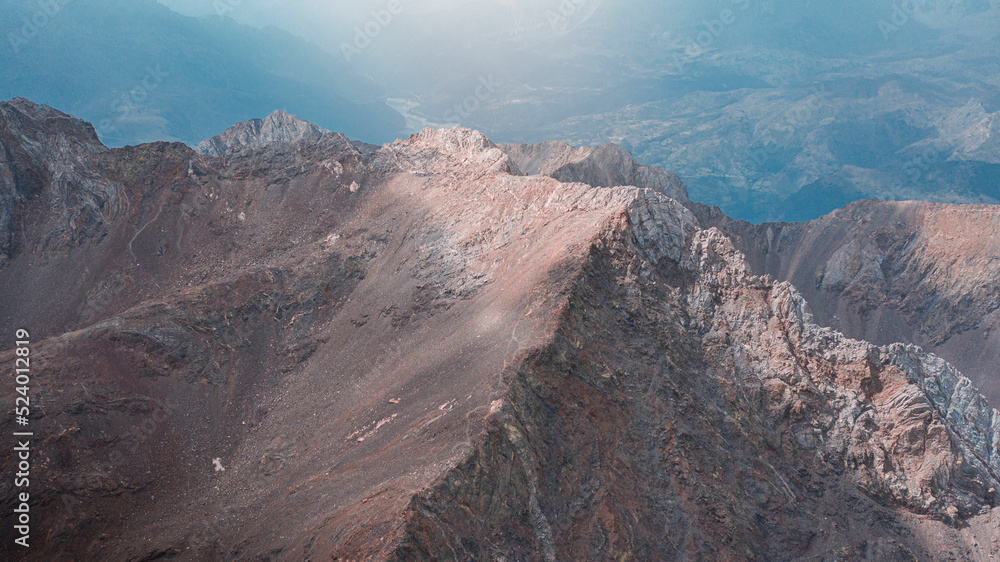Aerial mountain photography from a drone of peaks such as Los Infernos, Ibon de Pondiellos, a incredible trekking day from the Garmo Negro peak in Panticosa, Pyrenees of Aragon, Spain.