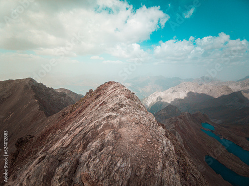 Aerial mountain photography from a drone of peaks such as Los Infernos, Ibon de Pondiellos, a incredible trekking day from the Garmo Negro peak in Panticosa, Pyrenees of Aragon, Spain. photo