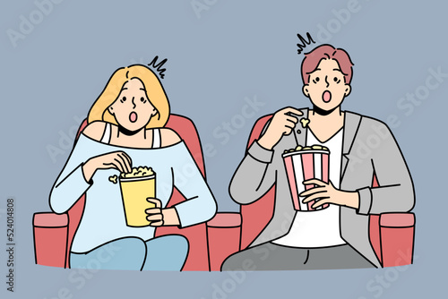 Couple eat popcorn enjoy movie in cinema. Emotional man and woman feel stunned with film in theater. Entertainment and weekend. Vector illustration. 