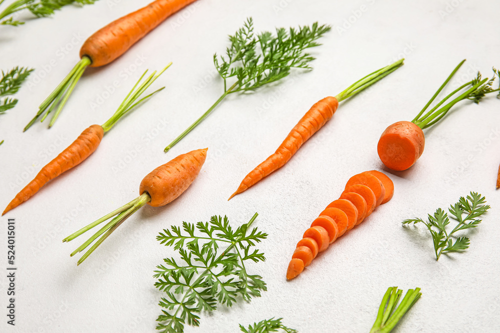 Composition with fresh carrots on light background Composition with fresh carrots on light background