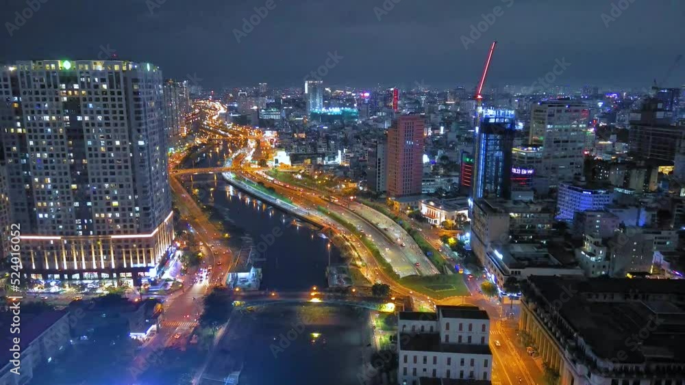 Aerial view of Bitexco Tower, buildings, roads, Thu Thiem 2 bridge and Saigon river in Ho Chi Minh city - Far away is Landmark 81 skyscraper. Travel concept. Aerial view of Bitexco Tower, buildings, roads, Thu Thiem 2 bridge and Saigon river in Ho Chi Minh city - Far away is Landmark 81 skyscraper. Travel concept.