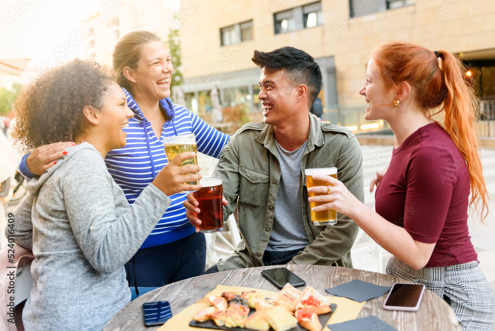 Cheerful friends drinking beer on street Cheerful friends drinking beer on street