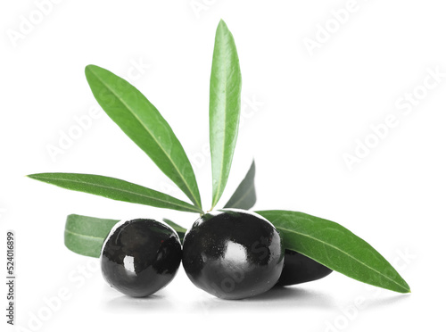 Delicious black olives with leaves on white background