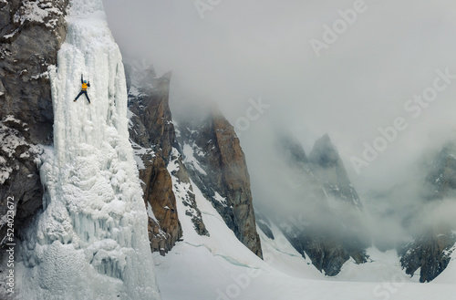 Ice climber in breathtaking scenery 
 photo