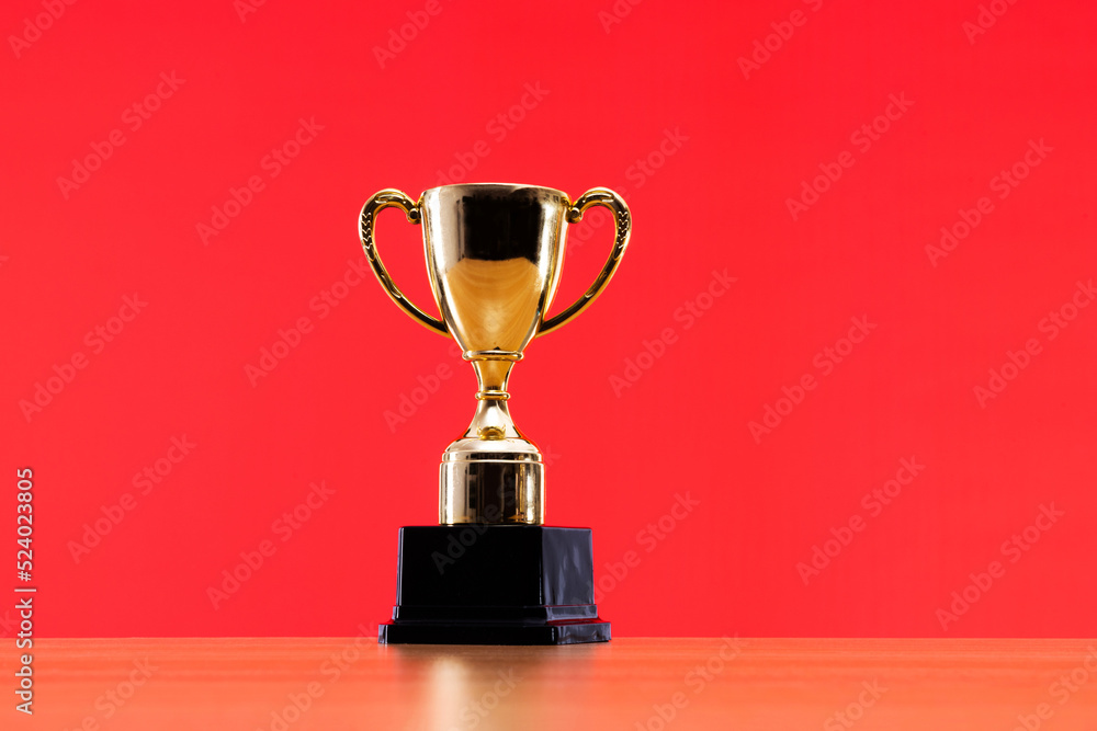 Golden trophy cup on the table Golden trophy cup on the table
