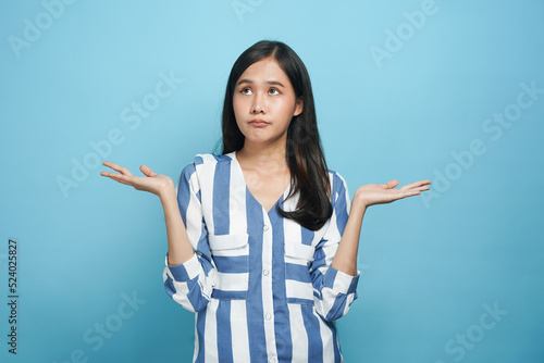 Asian young females unconcerned woman isolated on background photo