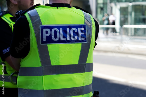 Canvas Print Police officer on duty on a city centre street during special event