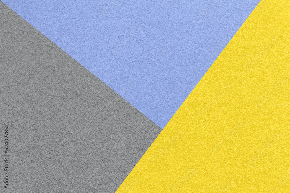 Texture of craft gray, yellow and blue shade color paper background. Structure of vintage abstract cardboard Texture of craft gray, yellow and blue shade color paper background. Structure of vintage abstract cardboard