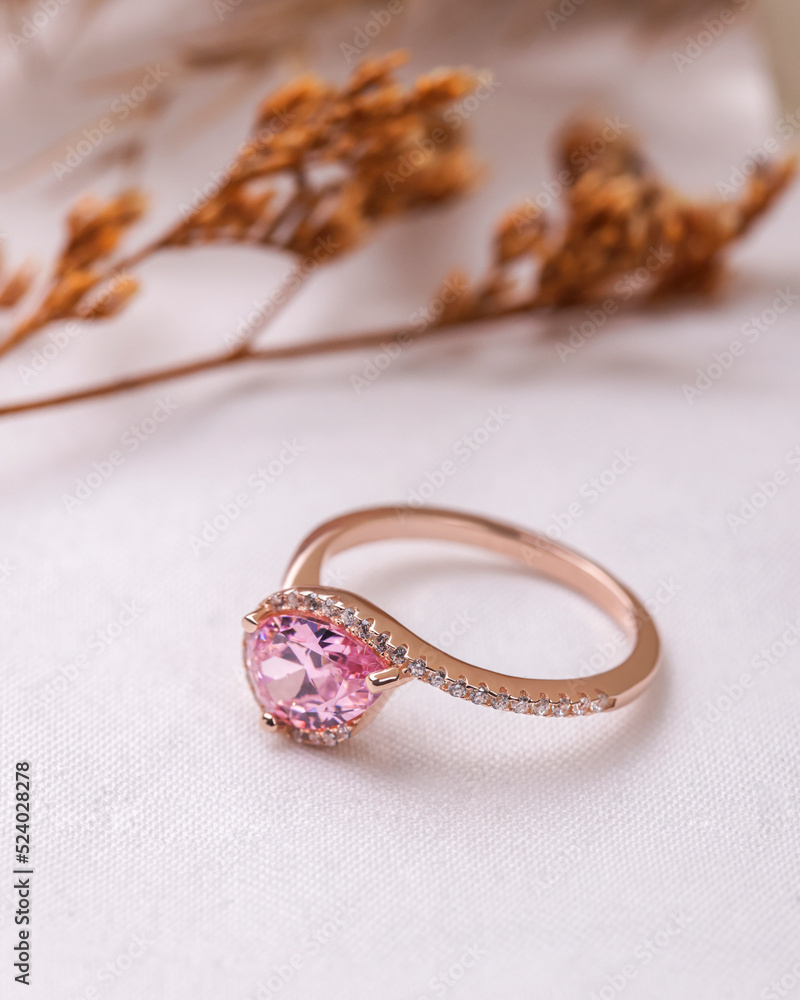 Diamond engagement ring isolated on creative paper background ,Diamond ting for women Diamond engagement ring isolated on creative paper background ,Diamond ting for women