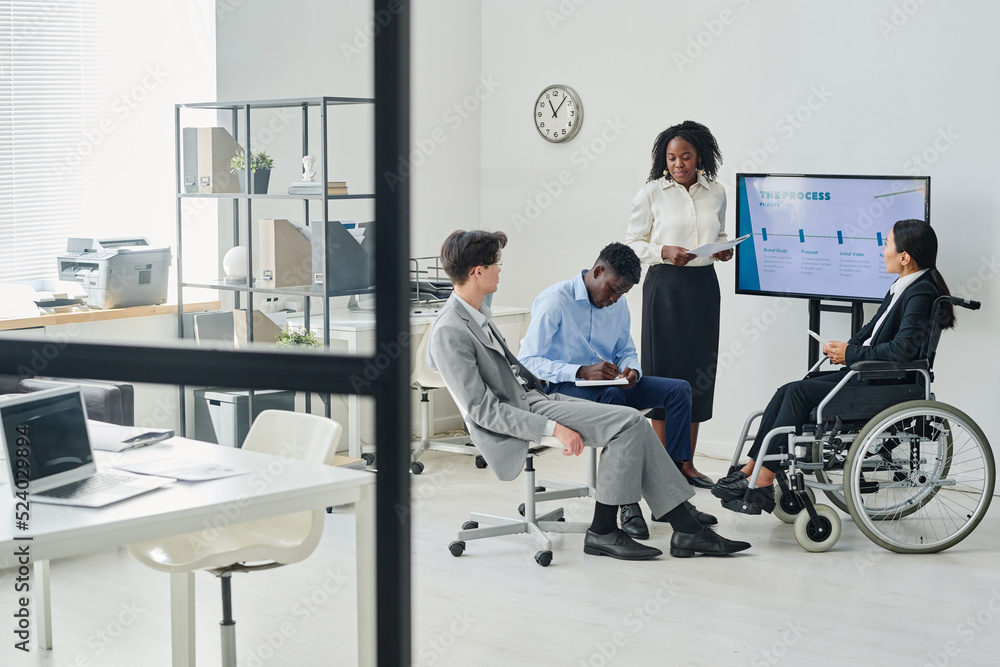 Business people cooperating and working in team during presentation at modern office Business people cooperating and working in team during presentation at modern office