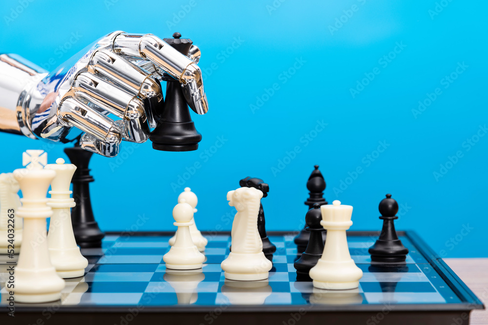 Robot hand holding chess pieces Stock 写真 | Adobe Stock