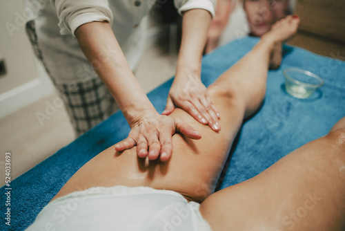 masseur doing a lymphatic drainage to a client in a beauty center