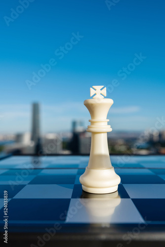 King chess piece on city background