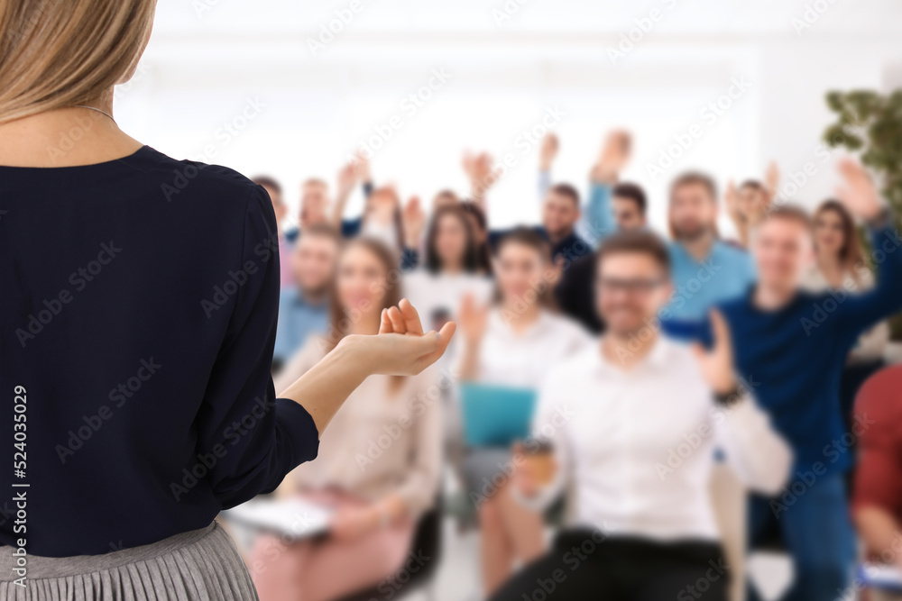 Motivational speaker giving speech in office, closeup view Motivational speaker giving speech in office, closeup view
