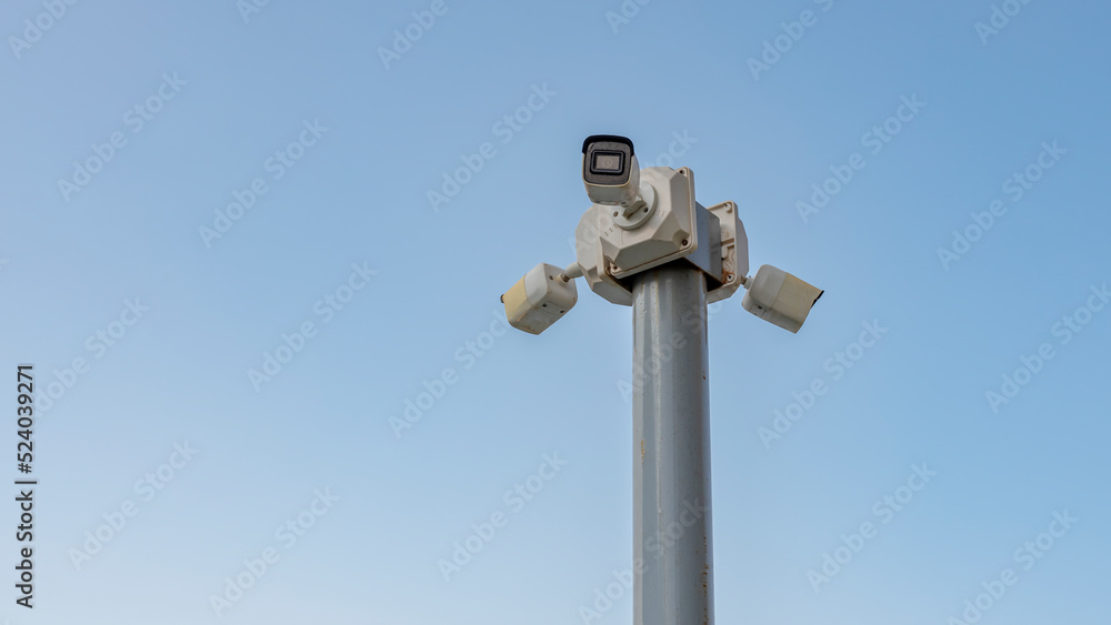 security camera in front of sky background, close up security camera in front of sky background, close up