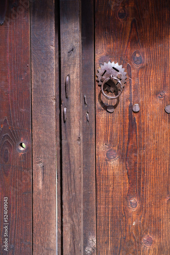 Old wooden door with iron handle 