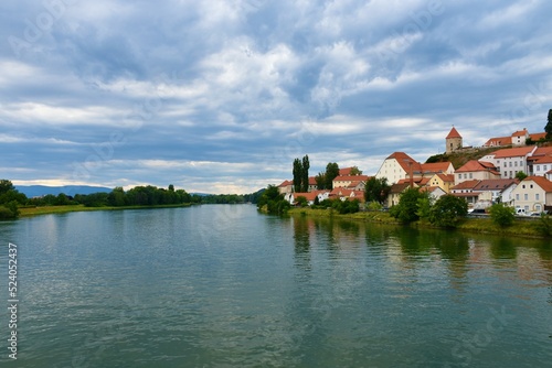 View of Drava river and Ptuj town on the shore in Stajerska, Slovenia with clouds in the sky