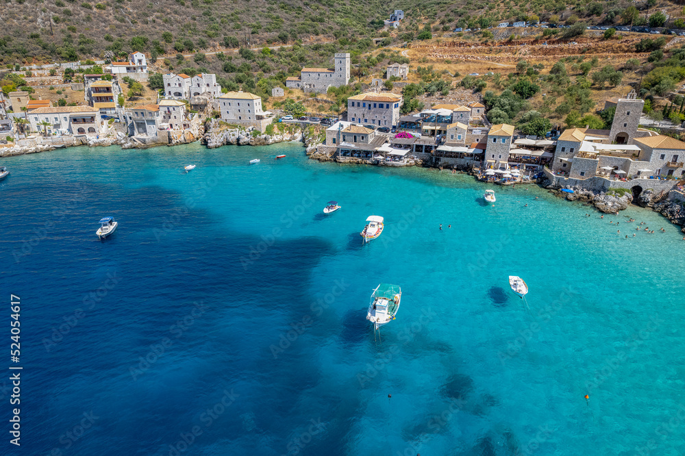 Aerial panoramic photo of Limeni the picturesque  villlage with the turquoise waters and the stone buildings under Areopoli, peloponnese , Greece.