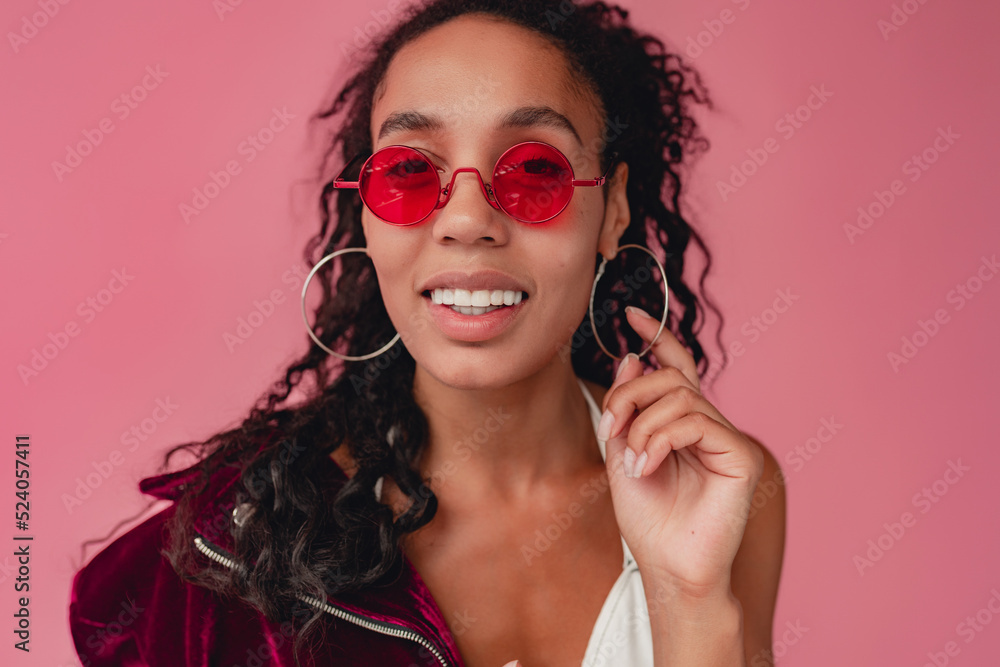 attractive black african american woman in stylish outfit on pink background attractive black african american woman in stylish outfit on pink background