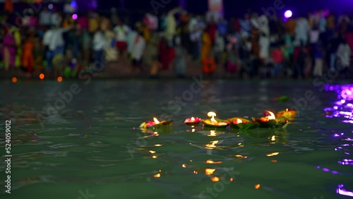 Shedding lamp and flowers after ganga aarti in haridwar photo