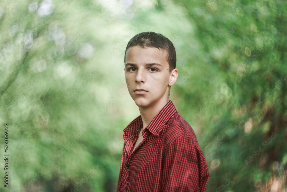 Portrait of a sad boy outside in nature Portrait of a sad boy outside in nature