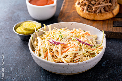 Fotografi Traditional cole slaw salad, side dish for pulled pork sandwich