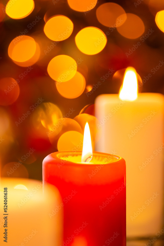 Close up shot of burning red and white candles. Gorgeous bokeh, Christmas background with copy space Close up shot of burning red and white candles. Gorgeous bokeh, Christmas background with copy space